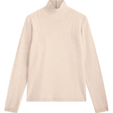 light pink cashmere turtle neck with deep modified drop sleeves