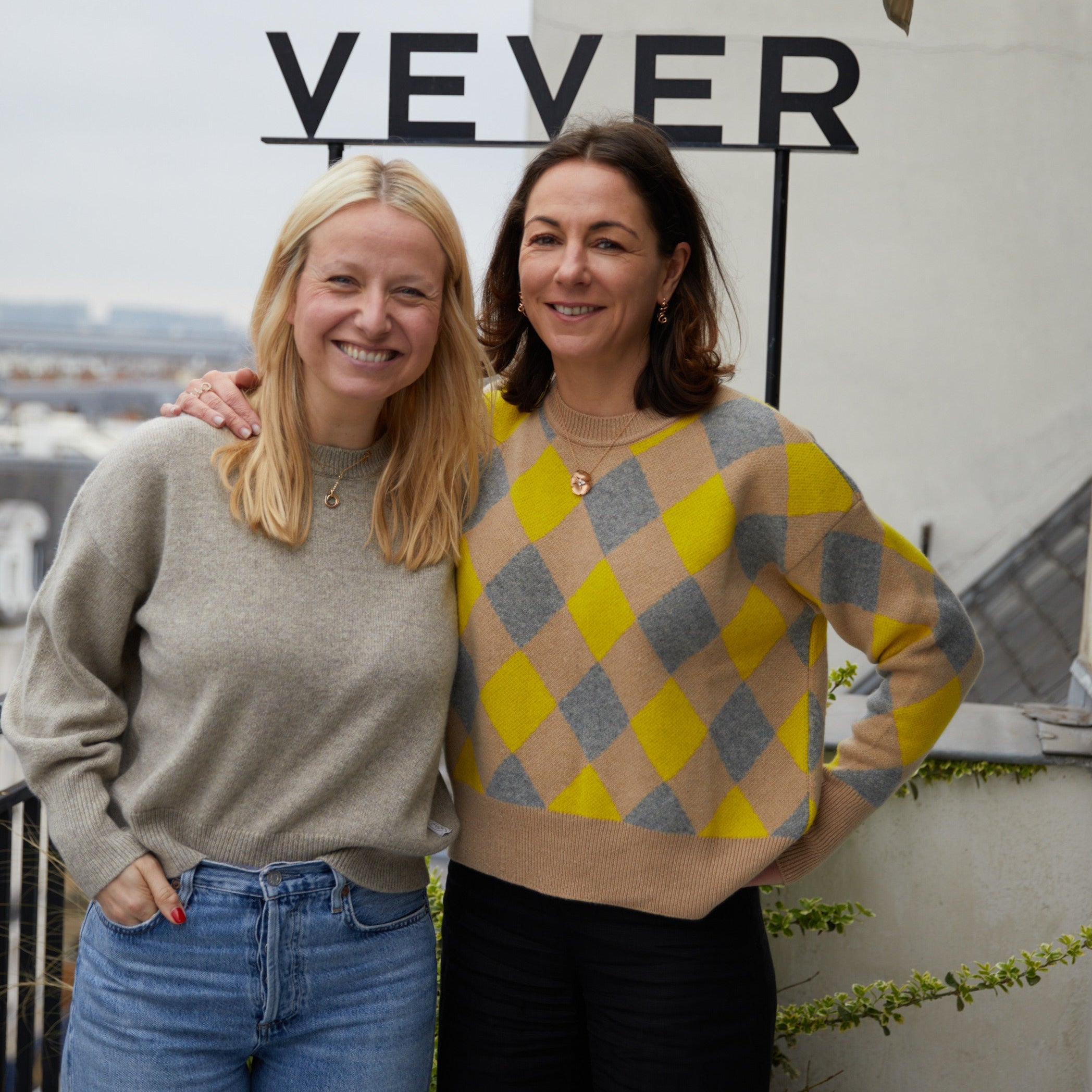 Camille Vever wearing the Sarah cashmere sweater in dark blue by Linnea Lund on the rooftop of the Vever jewelry maison in Paris.