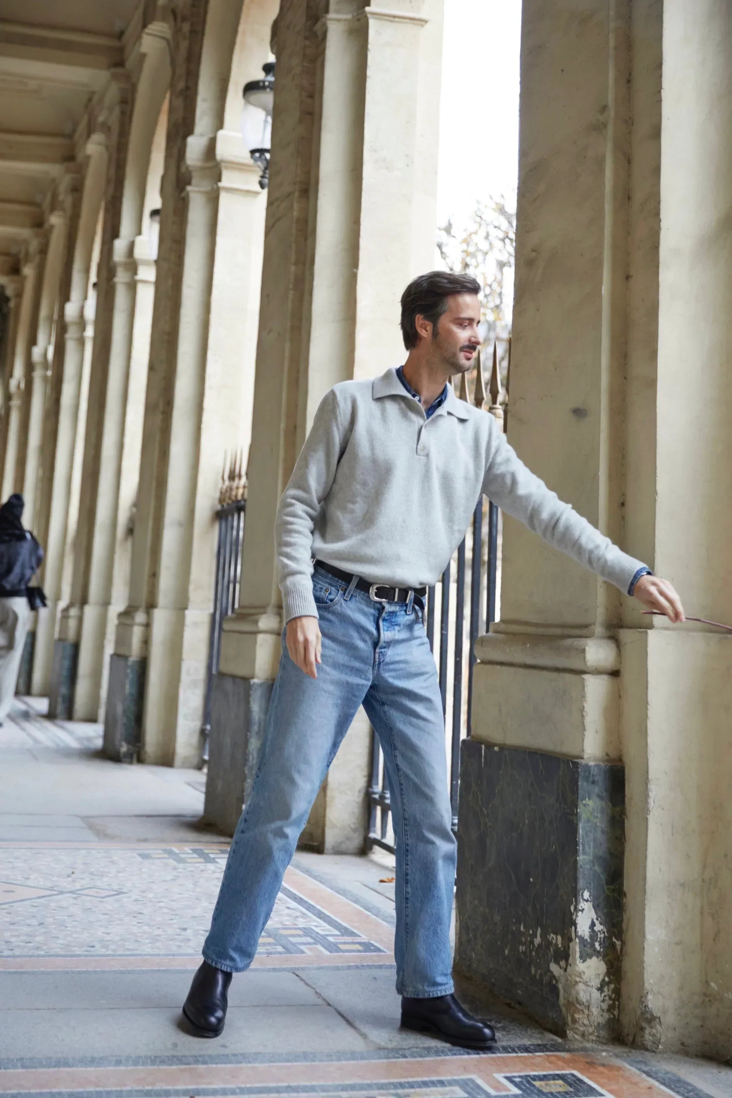 Adrien Coelho wearing the Ralph grey cashmere sweater by Linnea Lund at the Palais-Royal in Paris.