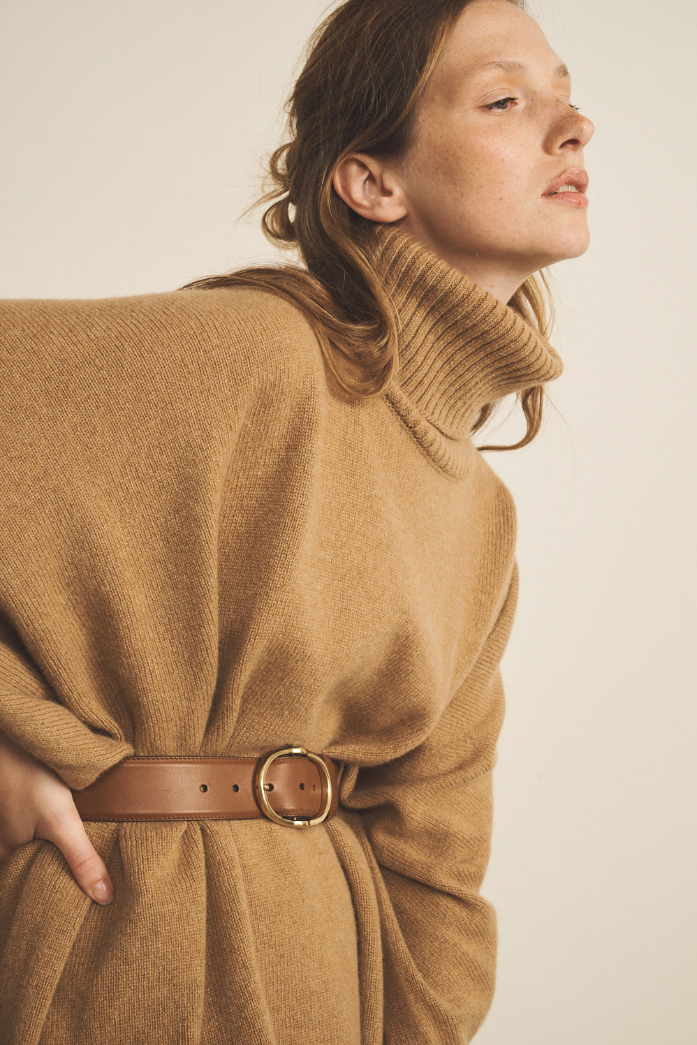 A camel, turtleneck women cashmere poncho with cut sides - side view | Angela | Linnea Lund