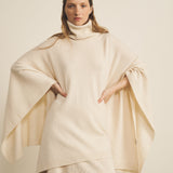 A white, turtleneck women cashmere poncho with cut sides - face view | Angela | Linnea Lund