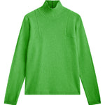bright green cashmere turtle neck with deep modified drop sleeves