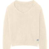 Off- white unisex cashmere sweater featuring a v-neckline, ribbed collar, loose fitting.
